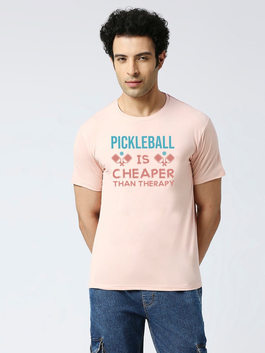 Peach color Pickleball tshirt with quote "Pickleball is Cheaper than therapy"